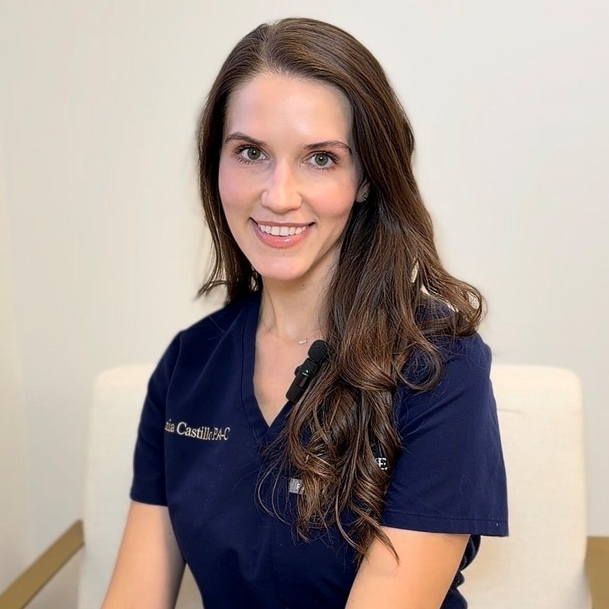 Smiling professional in medical attire.